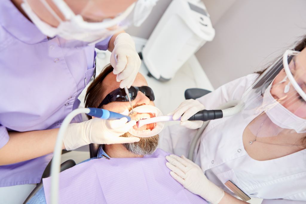 Dentists with masks and face shields