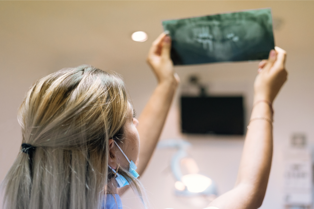 dentist holding up x-ray