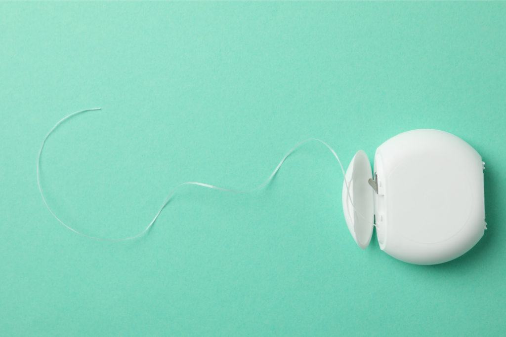 Tooth Floss on Mint Background