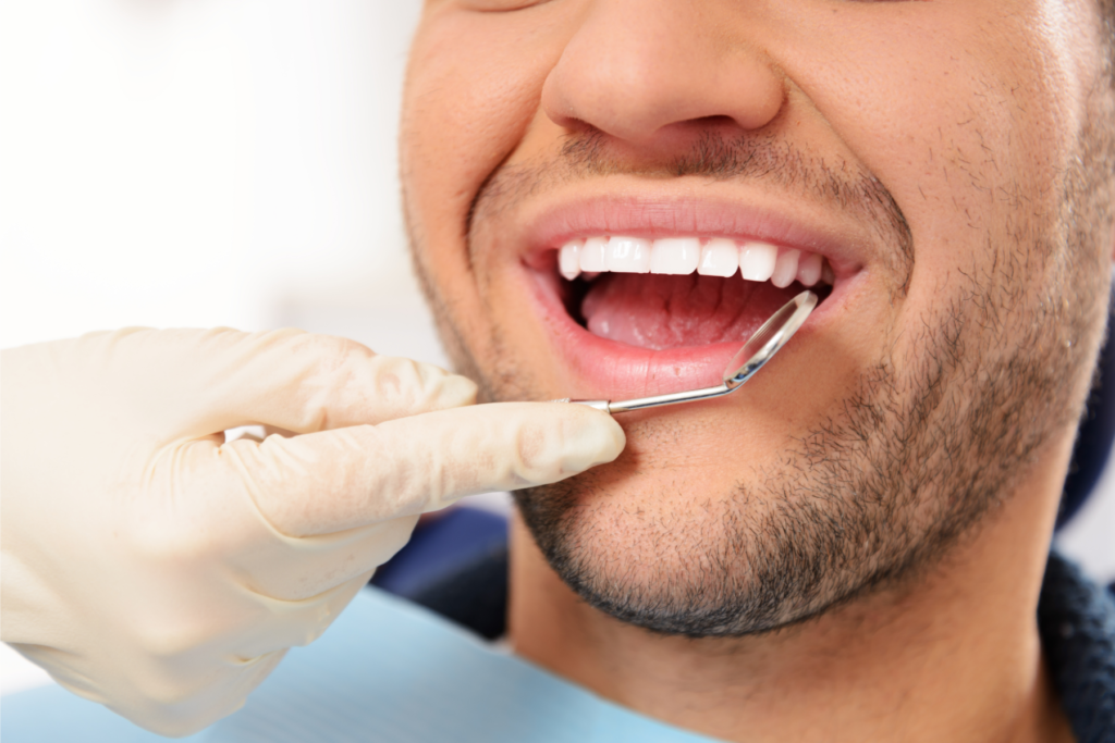 healthy gums and teeth checked by dentist